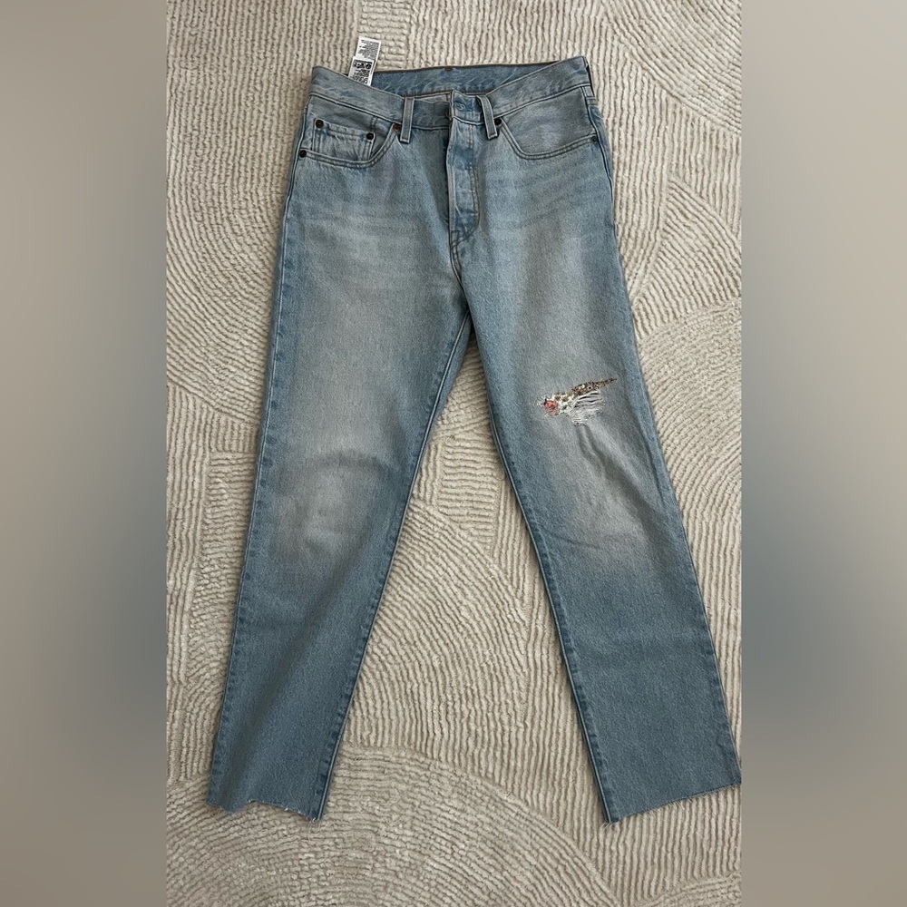 Levi's Light Blue  Jeans with Distressed Detail.size 27